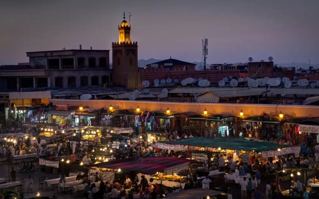 Jemaa el-Fnaa Square in Marrakech, bustling with activity and offering a glimpse into Morocco’s rich cultural life, one of the top things to do in Marrakech.