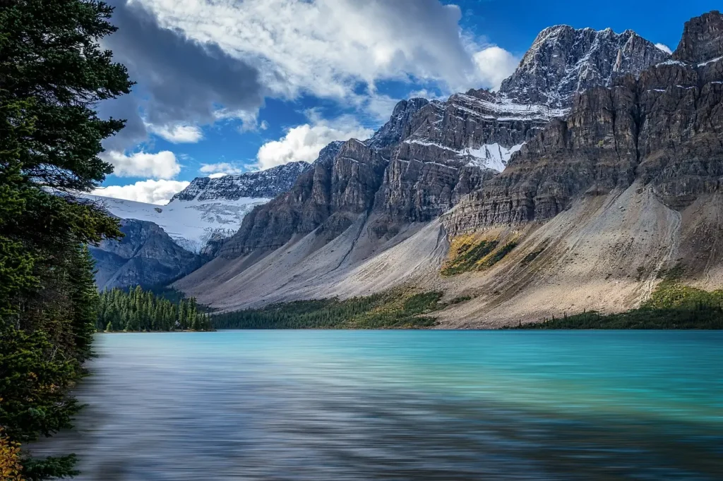  A serene view of Bow Lake in the United States, surrounded by majestic mountains and clear waters, epitomizing one of the best couple vacations in the US.