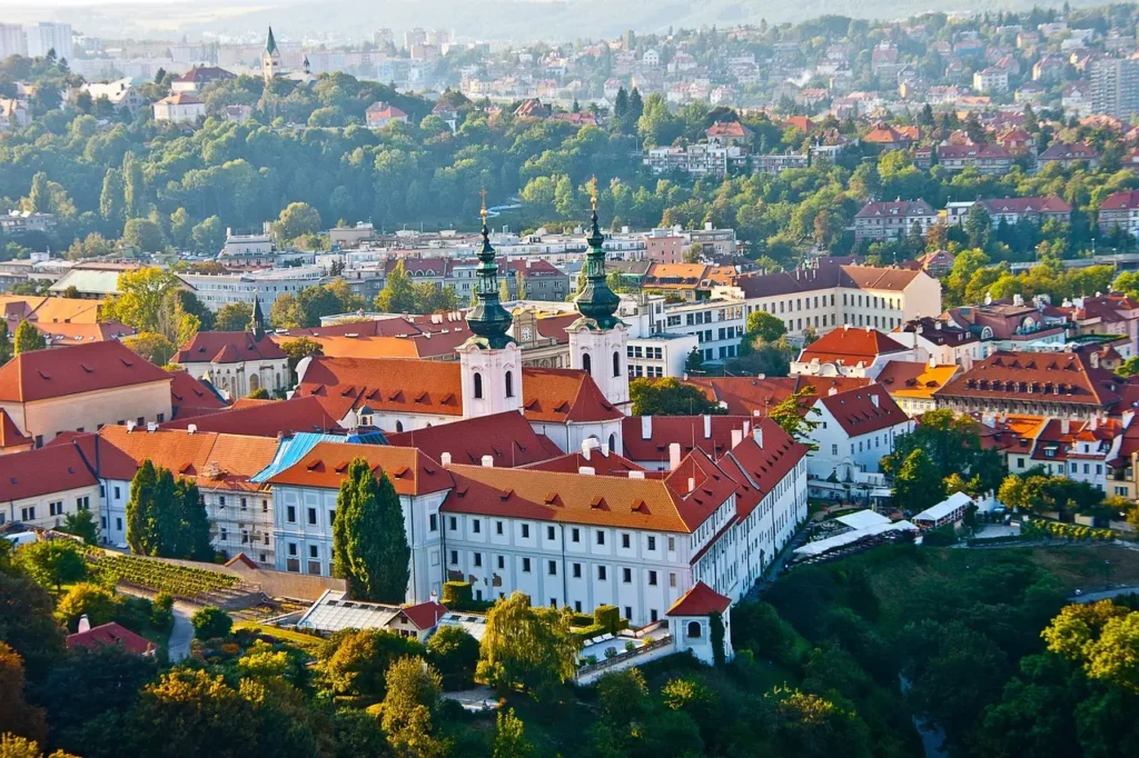 Solo traveler exploring Prague, one of the best places to solo travel in Europe, with stunning architecture and historic landmarks in the background.