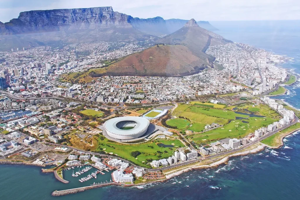 A stunning aerial view of Cape Town, one of the most beautiful cities in the world, showcasing Table Mountain, the coastline, and vibrant cityscape.