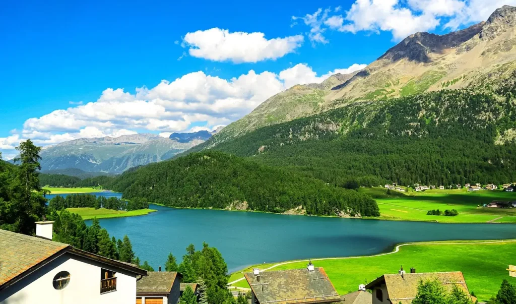 "A serene Swiss lake surrounded by majestic mountains, offering a perfect romantic getaway for couples.