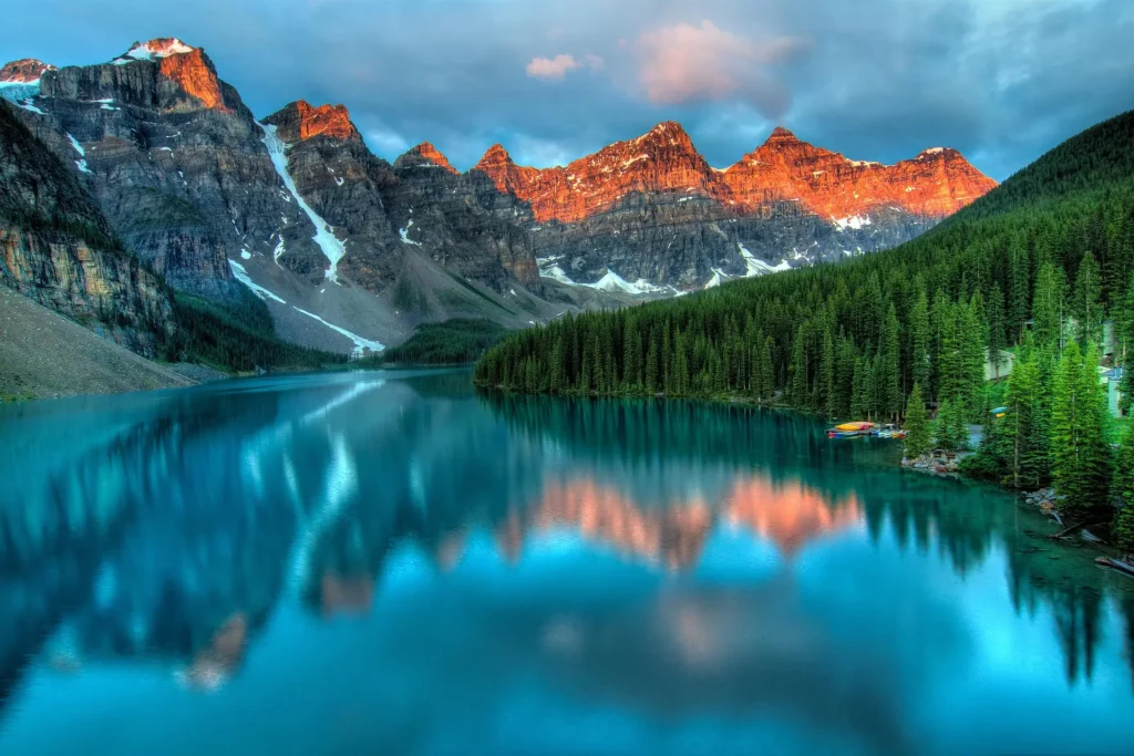  A tranquil mountain lake surrounded by lush greenery and towering peaks, exemplifying one of the best places to travel in February in the USA.