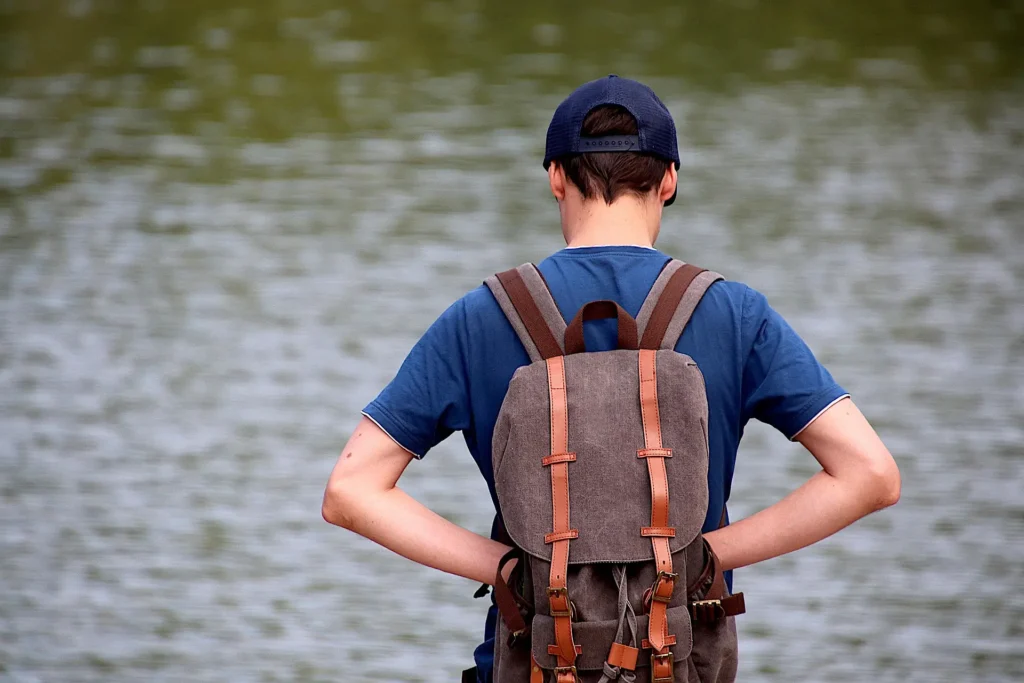 "Man Traveling with a Backpack in Nature