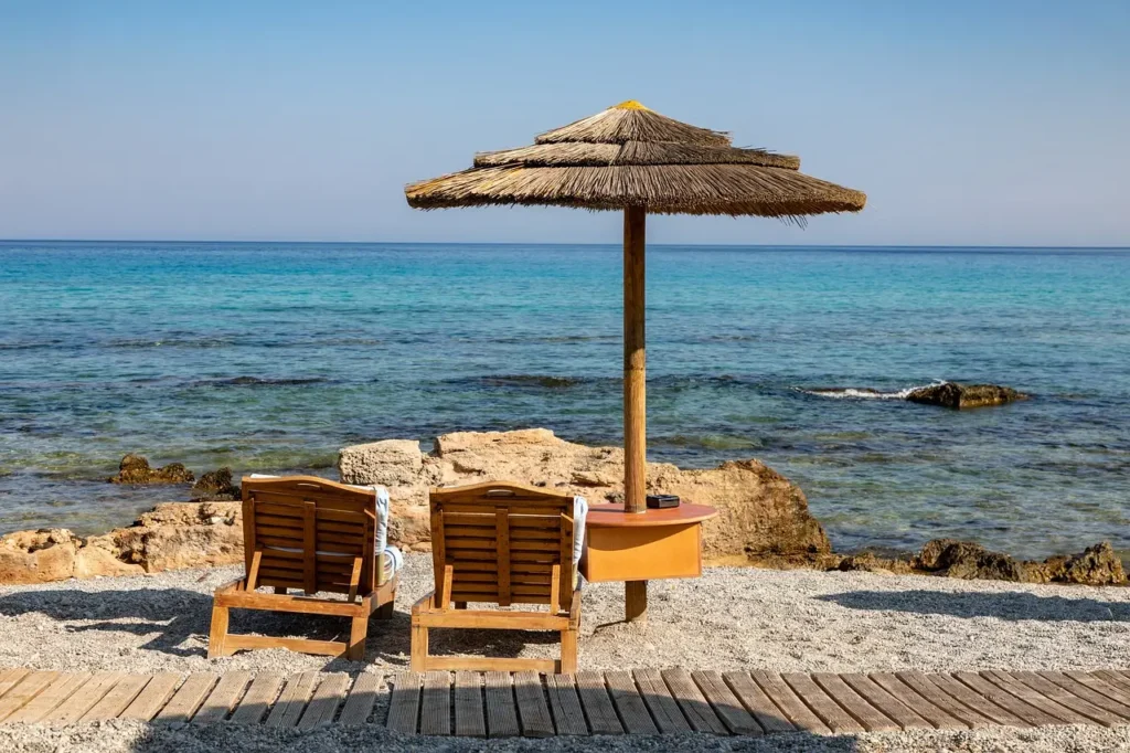  Beach chairs arranged on the sand, ready for a family going to the beach.