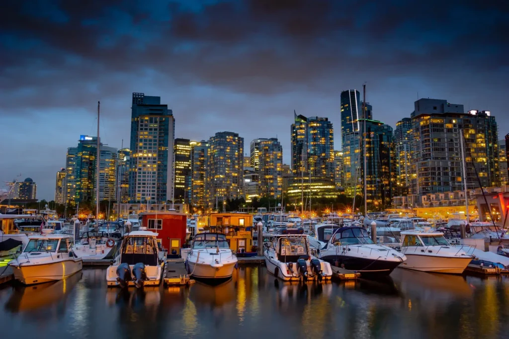 "Vancouver port skyline showcasing yachts and cityscape, highlighting one of the best cities to travel in Canada.