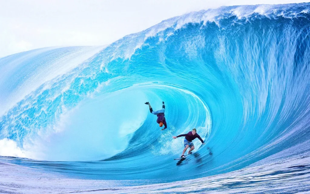 Surfer riding waves in Taghazout, Morocco, one of the best places to travel to in February for surfing."

