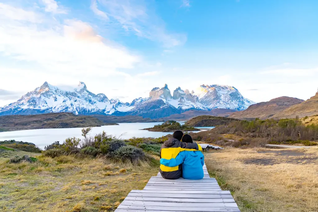 All Inclusive Resorts South America: Couple enjoying a guided hike in Torres del Paine National Park, Chile, as part of their stay at Explora Patagonia.

