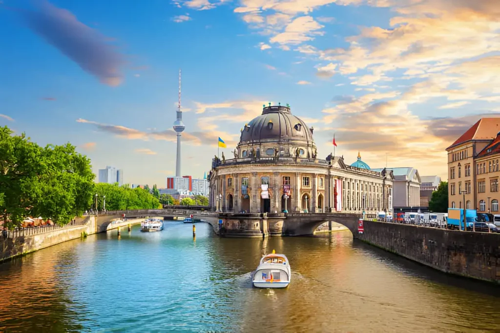 A panoramic view of Museum Island in Berlin, showcasing the Bode Museum and the bridge over the Spree River.