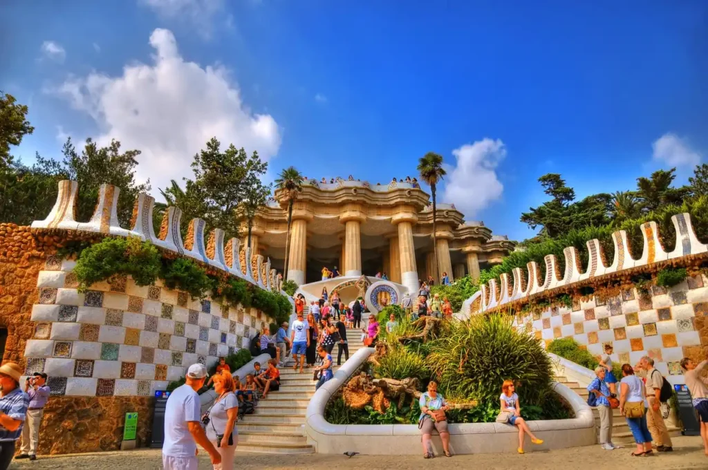 Travel to Barcelona spain - Tourists enjoying the park in Barcelona, capturing the essence of the city’s beauty."

