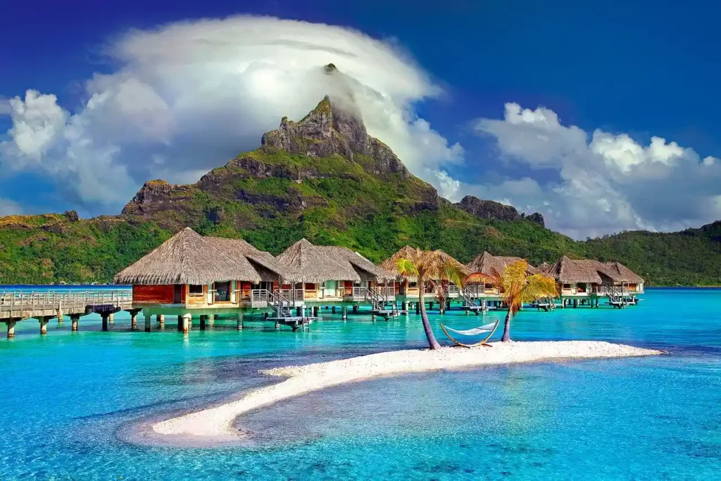 Overwater bungalows in Bora Bora, French Polynesia, showcasing luxury accommodations over crystal-clear waters.