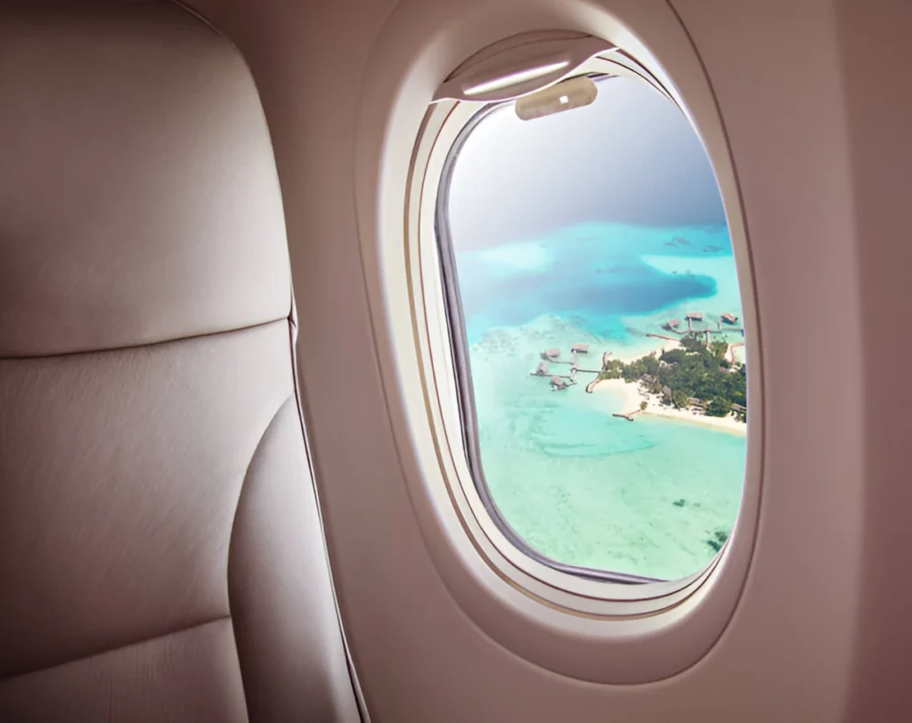 View from an airplane window showcasing the stunning islands of the Maldives.