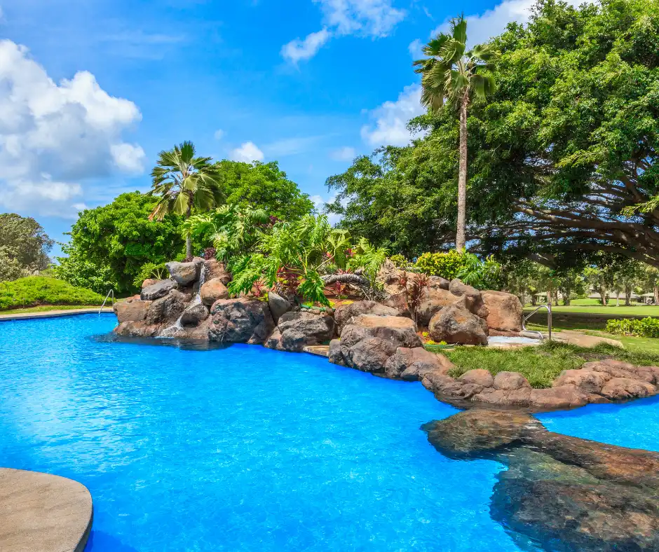 Tropical resort swimming pool in Kauai, Hawaii, showcasing one of the best places to stay in Kauai.