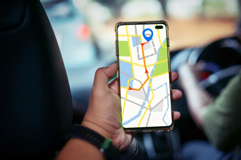 Man using app navigation map in the car to follow travel tips for a smooth journey.