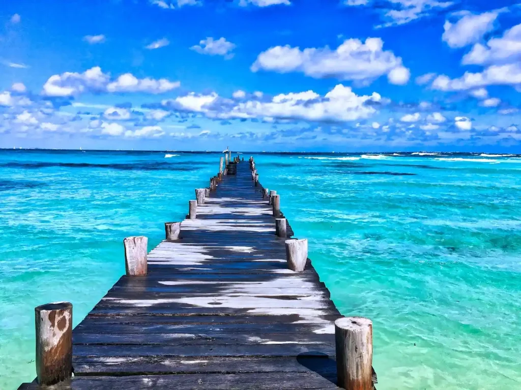 "Vivid sunlit beach scene capturing best time to travel to mexico beach fl with sparkling waters and golden sand."