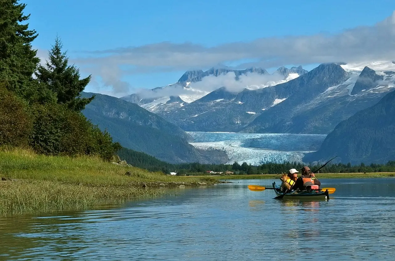 A serene view of a lake in one of the best cities to live in Alaska, showcasing the state's natural beauty.