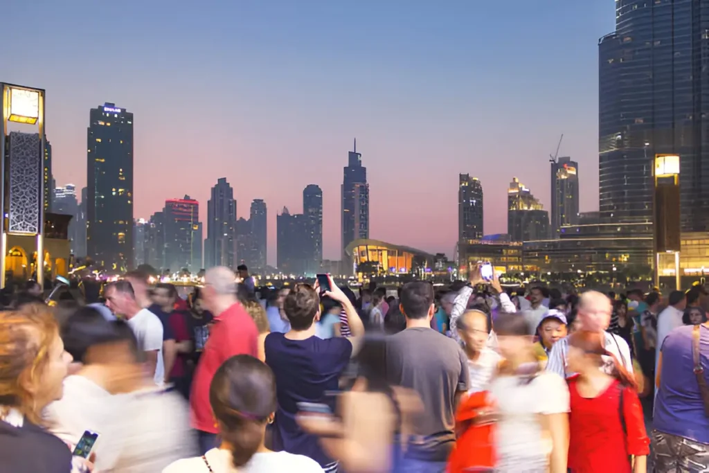 Vibrant Dubai nightlife showcasing bustling streets and illuminated skyscrapers, highlighting the city's dynamic entertainment scene.