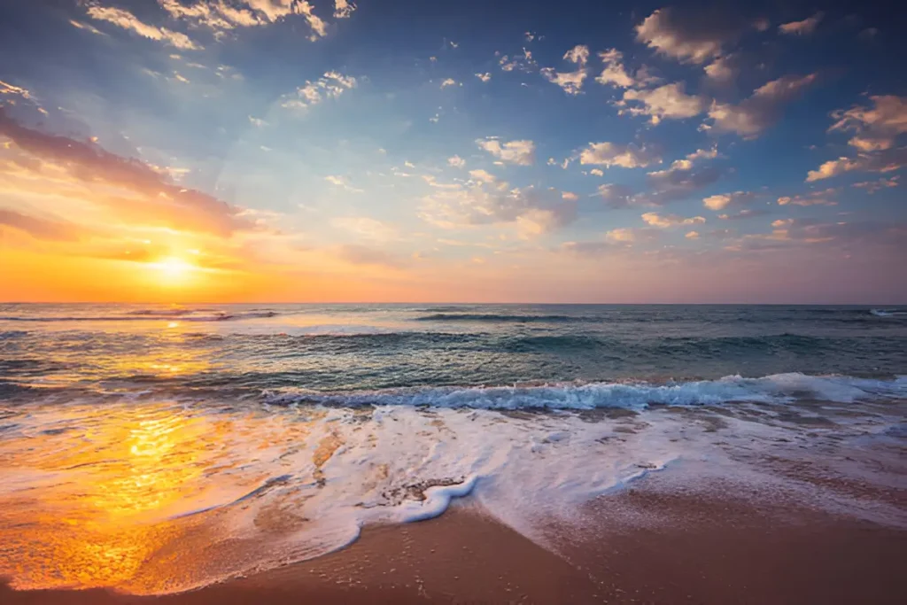  Stunning ocean sunrise over a tropical sea shore, showcasing a serene beach aesthetic with golden sands and gentle waves.