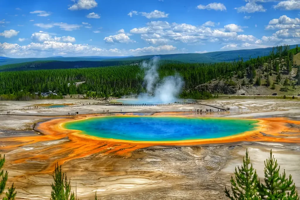 "Yellowstone National Park in spring with vibrant geothermal features and lush landscapes, showcasing one of the best places to travel in May USA."

