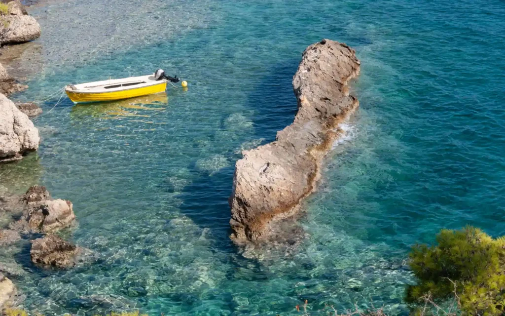 Tranquil Coastal Waters and Fishing Boat in Paros, Greece